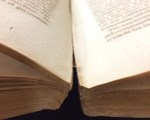 Photo showing the stitching coming undone at the bottom of the book
